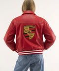 Premium red leather racing jacket for women with fitted silhouette - back view