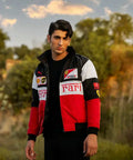 Person wearing a Ferrari jacket in an outdoor setting